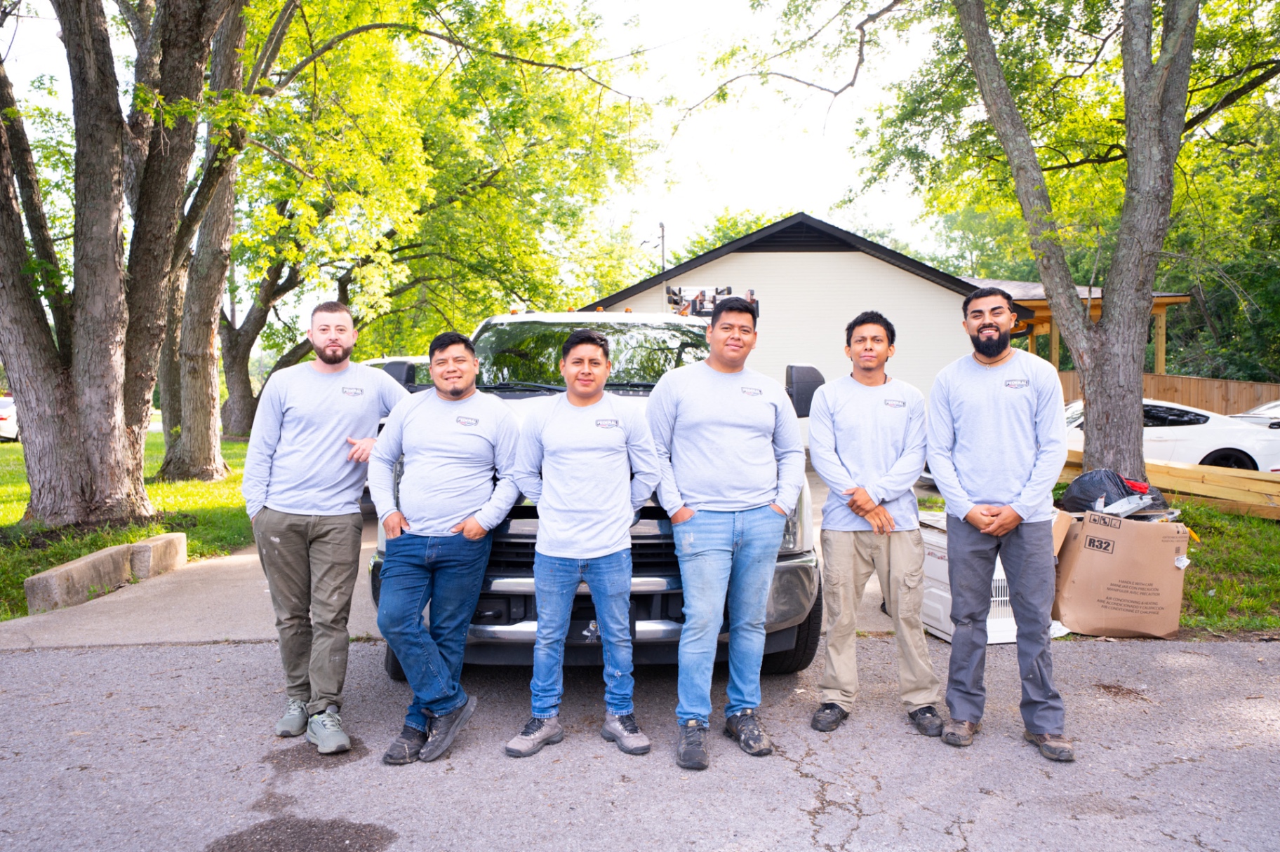 Federal Heating & Cooling install crew standing in front of a service truck